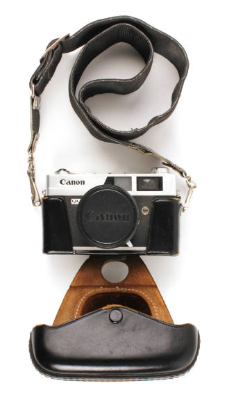 Canon Canonet QL17 camera in a black leather case with strap