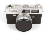 Black and silver Canon Canonet QL17 camera with black lens cap