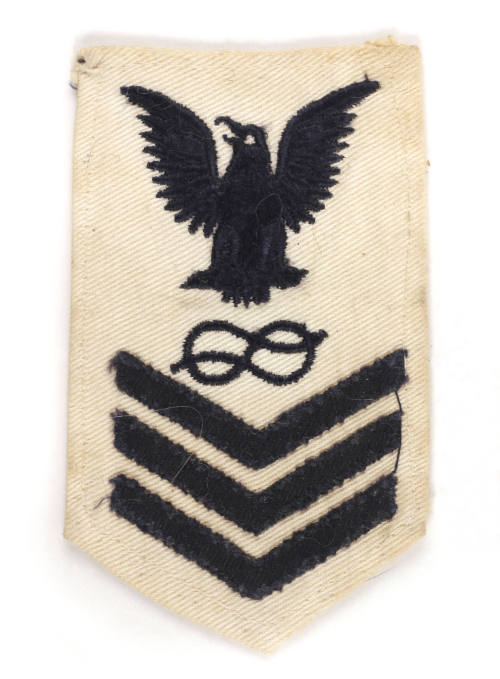White U.S. Navy uniform patch with dark blue eagle, chevrons and figure-eight knot
