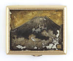 Cover of cigarette case with gold frame, image of Mount Fuji emerging from clouds in center