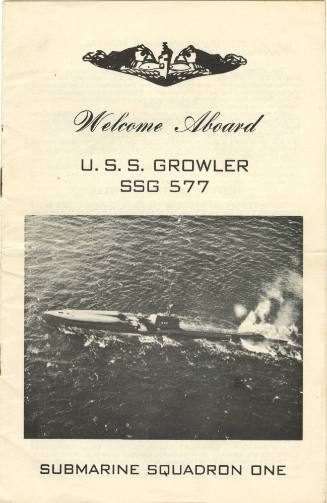 Cover of a "Welcome Aboard" booklet with a black and white overhead photograph of the submarine…