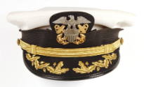 U.S. Navy officer combination cap with white cover and gold oak leaf embroidery on visor