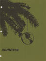 Green cover of USS Intrepid newspaper The Achiever with image of pine tree bough and globe hang…