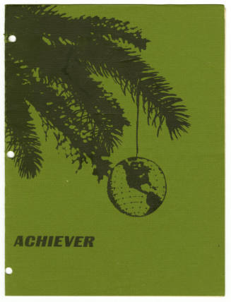 Green cover of USS Intrepid newspaper The Achiever with image of pine tree bough and globe hang…
