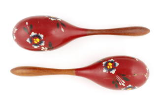 Pair of red wooden maracas with black, blue, white and yellow floral pattern painted spiraling …
