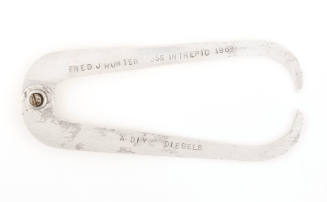 Silver calipers with engraved text “Fred J Hunter USS Intrepid 1968 A Div Diesels”