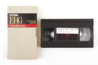 Image of VHS tape with "USS Intrepid" handwritten in blue ink and tan, black, and read box titl…