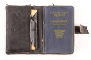 Inside black leather cover with blue Sunday missal and pocket with papers