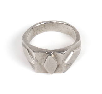 Silver metal ring with three raised diamond shapes