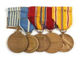 Back of ribbon bar with five World War II service medals attached