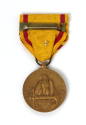 Back of China Service Medal with yellow and red striped ribbon and circular bronze medal with i…