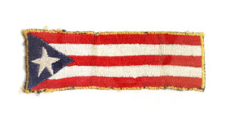 Rectangular liberty cuff patch depicting embroidered Puerto Rican flag