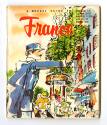 Printed color booklet titled "A Pocket Guide to France" with a street scene
