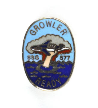 USS Growler insignia pin with colored enamel image of a hand reaching out of water and grabbing…