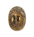 Back of pin with butterfly clasp visible and pitted bronze patina