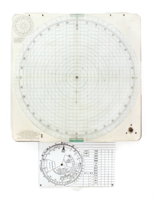 Square, white plotting board with green concentric circles extending from the center