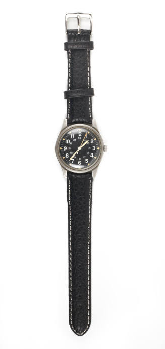 Wristwatch with black watch face and white numerals and black strap band