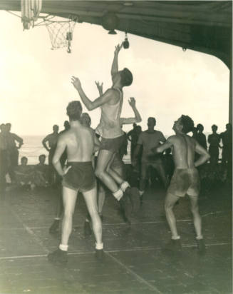 Black and white photograph of a basketball game on the aircraft carrier USS Intrepid