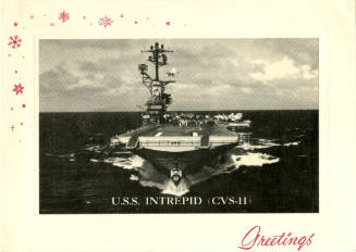 Printed holiday card with a black and white photograph of USS Intrepid at sea and red snowflake…