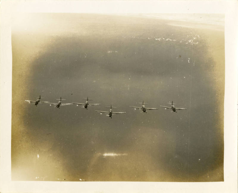 Printed black and white photograph of Grumman TBF-1C Avengers in flight