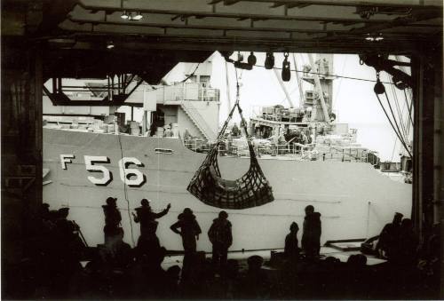 Black and white photograph of underway replenishment from USS Denebola to USS Intrepid through …