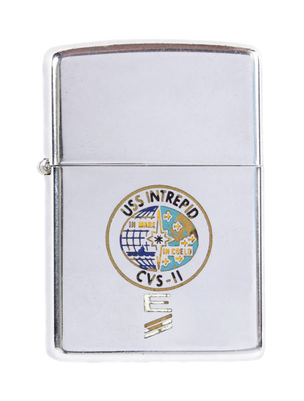 Silver lighter with a circular enamel USS Intrepid seal, below the seal is a Battle Efficiency …