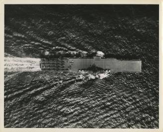 Black and white aerial photograph of USS Intrepid at sea