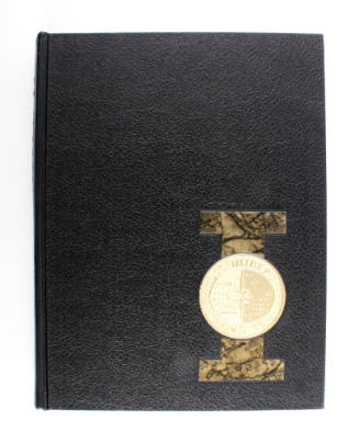 Black 1971 USS Intrepid yearbook with gold seal on over a marbled "I"