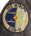 Detail photograph of USS Intrepid seal patch, inscription reads "USS Intrepid CVS-11, In Mare I…