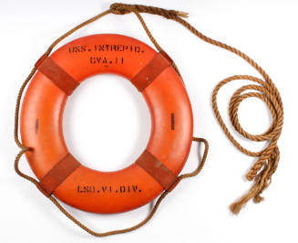 Orange USS Intrepid life ring with rope attached