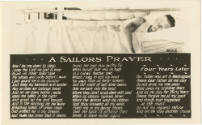 Black and white postcard from U.S. Naval Training Station, Great Lakes, Illinois with a sailor …