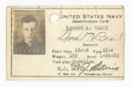 Printed Navy Identification card for Donald A. Braid with a black and white photograph of him
