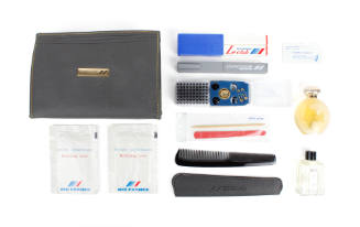 Air France toiletry kit with comb, perfume, cologne, toothbrush and other amenities