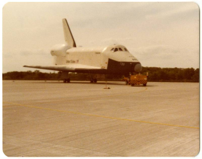 Color photograph of Space Shuttle Enterprise on a runway 