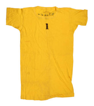 Yellow short sleeved t-shirt with black stencil at top center that reads "1"