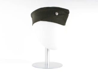 Forest green garrison cap with silver oak leaf pin on mannequin head form