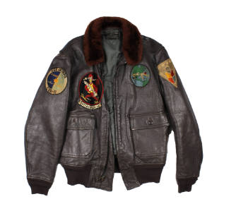 Brown leather flight jacket with fur collar and numerous patches