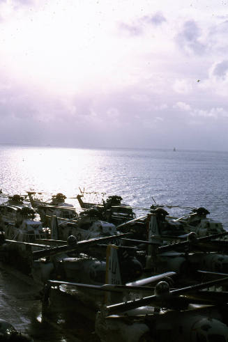 Color photograph of aircraft lined up on the flight deck