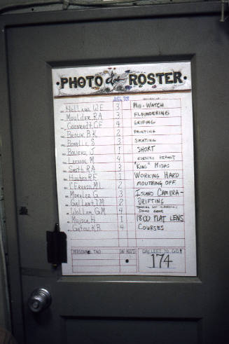 Color photograph of Photo Lab Roster posted on a door