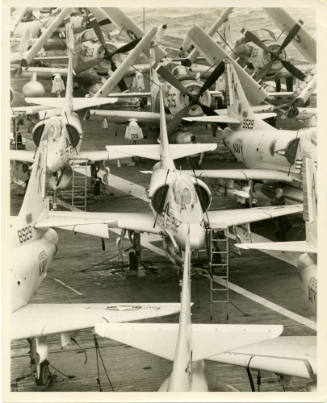 Black and white photograph of Skyraiders and Skyhawks on the flight deck