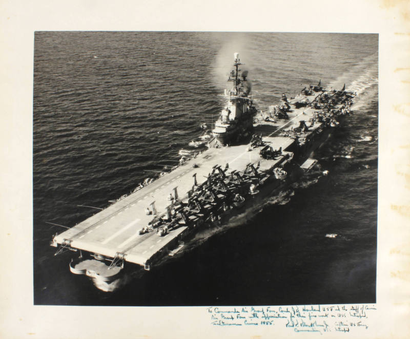 Black and white photograph of USS Intrepid at sea with a handwritten inscription on the bottom …