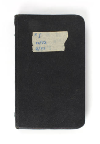Black logbook with "#1 12/42 2/43" written on a piece of tape in blue ink