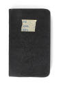 Black logbook with "#4 5/43 7/43" written on a piece of tape in blue ink