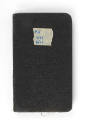 Black logbook with "#5 7/43 8/43" written on a piece of tape in blue ink