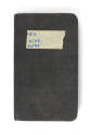 Black logbook with "#7 9/43 10/43" written on a piece of tape in blue ink