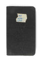 Black logbook with "#9 12/43 2/44" written on a piece of tape in blue ink