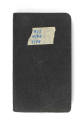 Black logbook with "#11 4/44 7/44" written on a piece of tape in blue ink