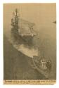 Printed newspaper clipping of a photograph of Intrepid being tugged into port titled "The Intre…