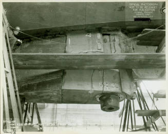 Black and white photograph of damage to USS Intrepid’s rudder post casting in dry dock