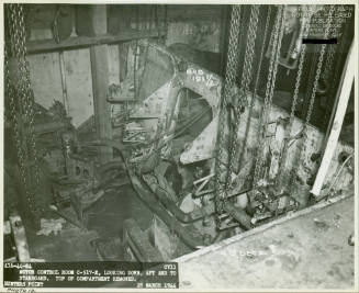 Black and white photograph of motor control room on USS Intrepid during repairs